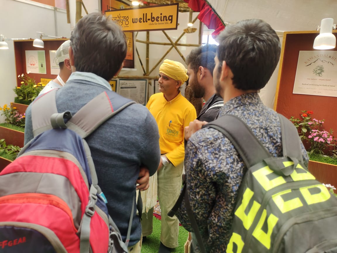 MahAcharyaJi Sourabh J Sarkar in his yellow turban engaging visitors and generating leads at the stall